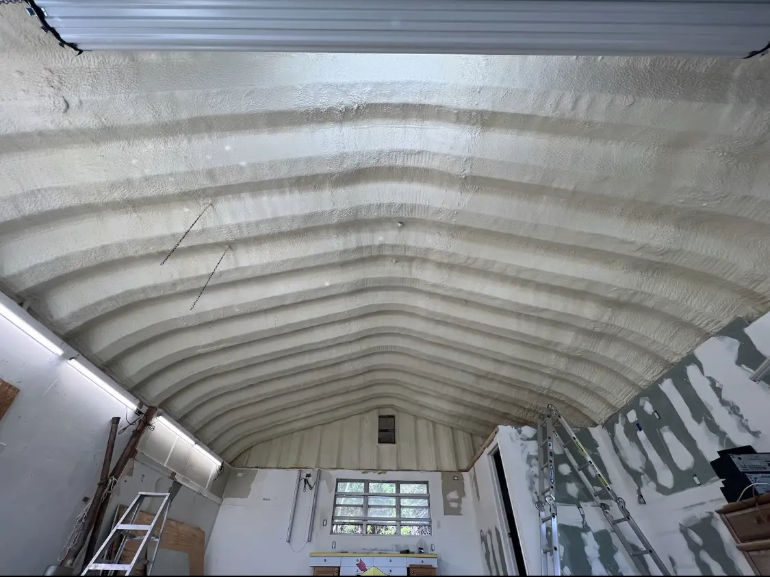 Spray polyurethane foam applied to the underside of a metal roof deck in Alabaster